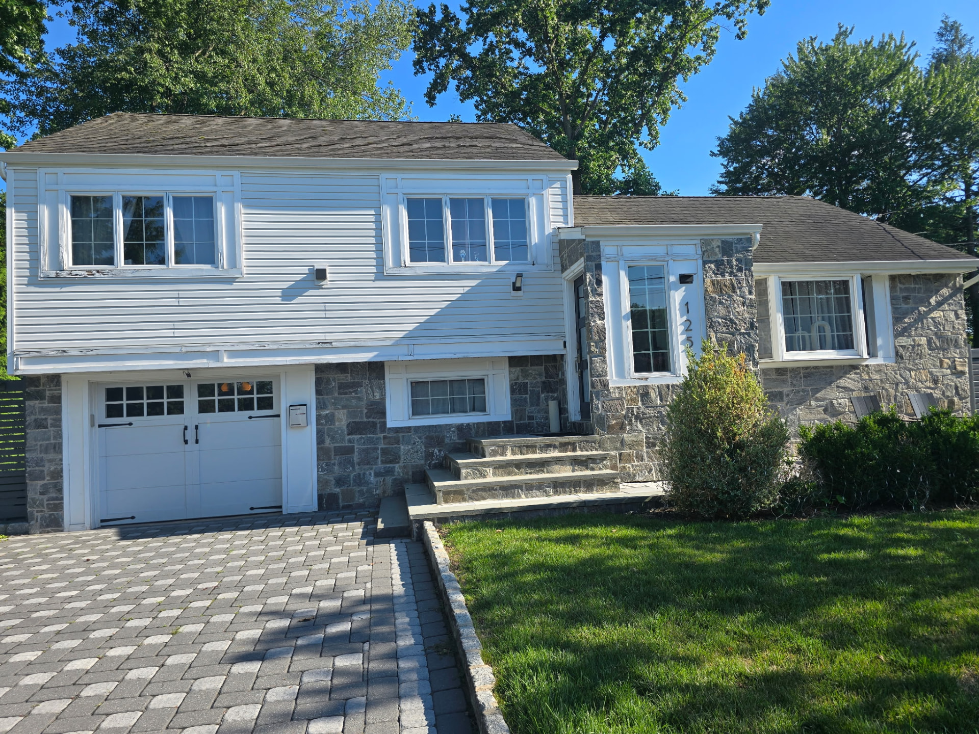 Stone and siding split-level home exterior